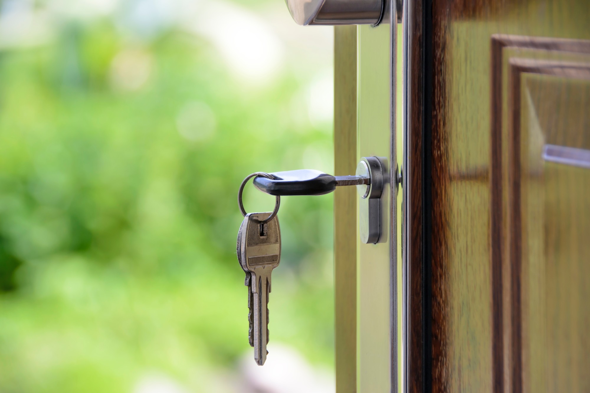 Key in the front door of a home