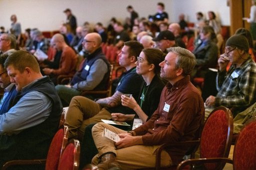 Attendees watch intently during a TCNewTech pitch