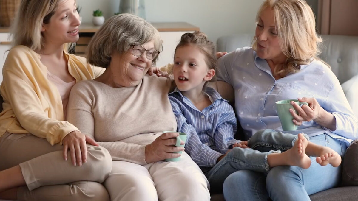 family talking and laughing on a couch